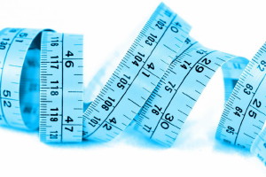 A loosely rolled up measuring tape